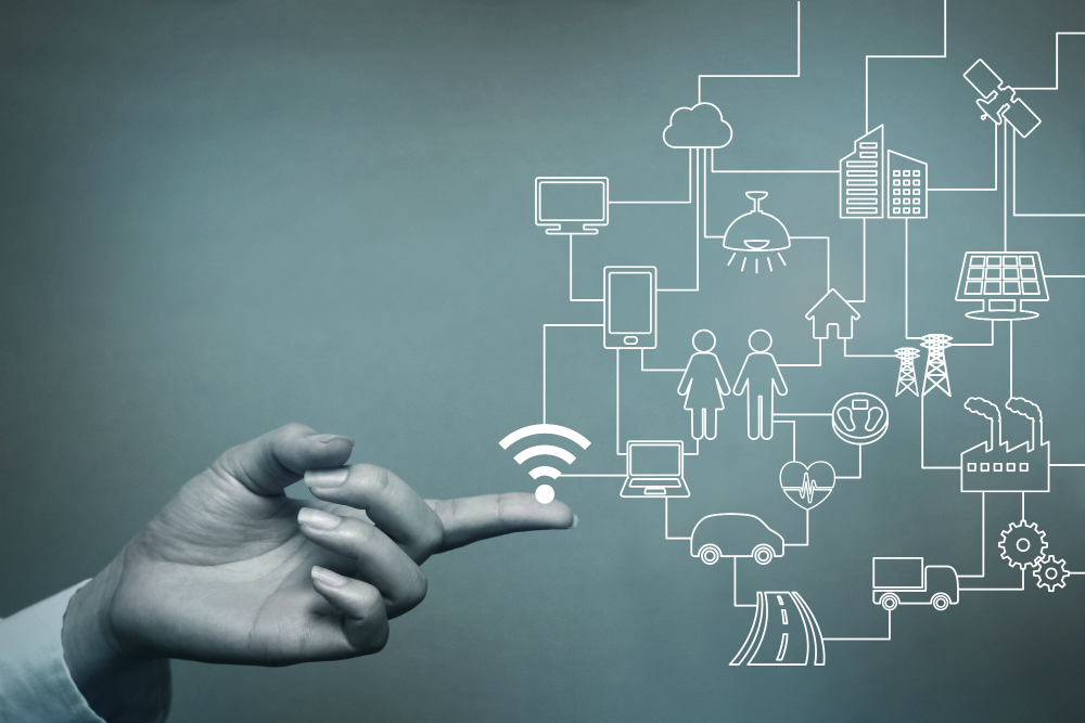 Hand pointing at digital network icons.