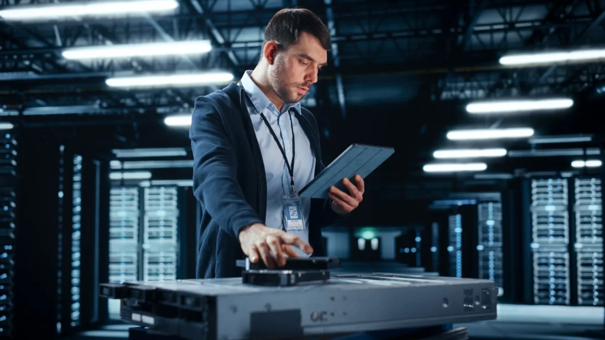 On-site IT support technician working in a server room